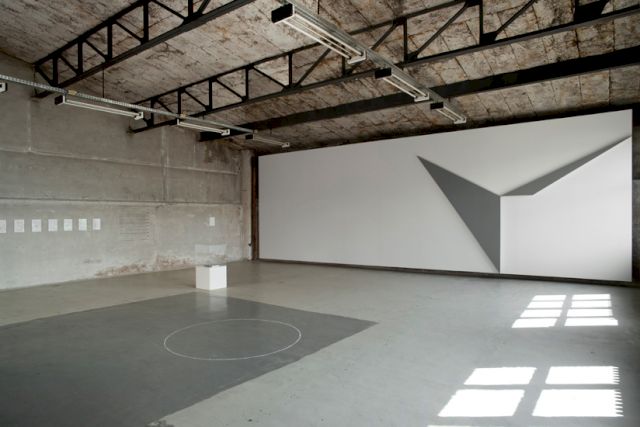 Installation view with the work ’the distance between you and me’ by Stanley Brouwn