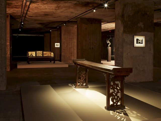 Installation view of The Feuerle Collection, Berlin. ’Side table with everted ends’, 17th Century; ’Lohan Bed’, 17th Century; Zeng Fanzhi, ’Untitled’, 2009; work by Nobuyoshi Araki. Photo: Nic Tenwiggenhorn – © VG Bild-Kunst, Bonn 2017