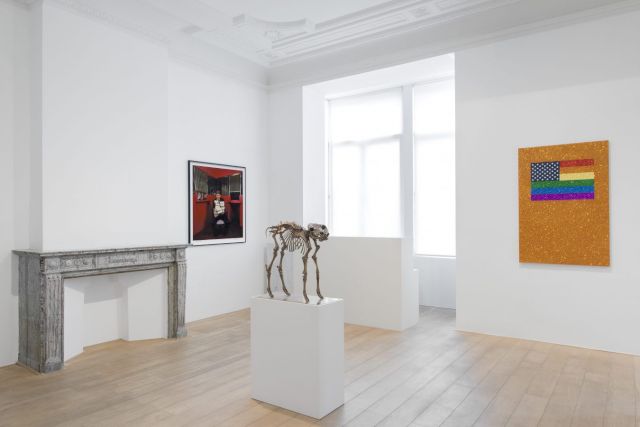 (l–r) HARRY BENSON, Donald Trump, The Taj Mahal Casino, Atlantic City, 1990. Photo: Harry Benson CBE; SHERRIE LEVINE, False God, 2007; JONATHAN HOROWITZ, Rainbow American Flag on Orange Field II for Jaspers in the Style of the Artists Boyfriend, 2015 Courtesy Jonathan Horowitz and Xavier Hufkens Brussels. © Charles Riva Collection, Thomas Mueller, Hugard and Vanoverschelde