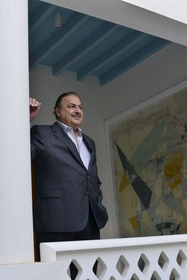 Rashid Al Khalifa standing aside his mural painting at Riffa Majlis, Riffa, Kingdom of Bahrain, 2016. Photo: Manfred Erber