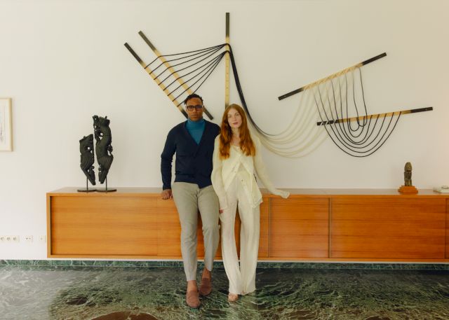 Portrait of Issa and Lisa Masé in front of: Falling Lines 1.0 (2022) by Issa Masé & Seth Damm and LoveBirds (2022) by Erika Weitz - Photo by Evelyn Dragan for The Ori House Home Portraits